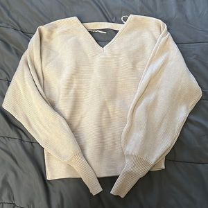 Subtle but enticing long sleeve with a cute v-neck front and back